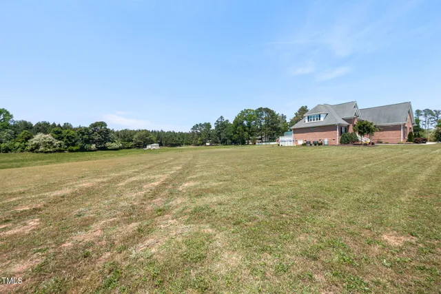 a view of a lake with houses in the back