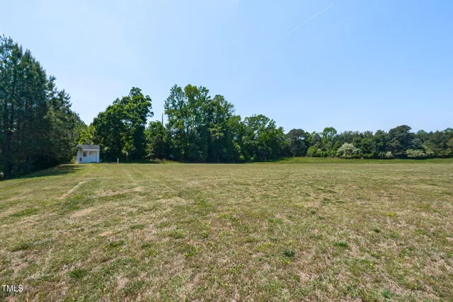 a backyard of a house with lots of green space