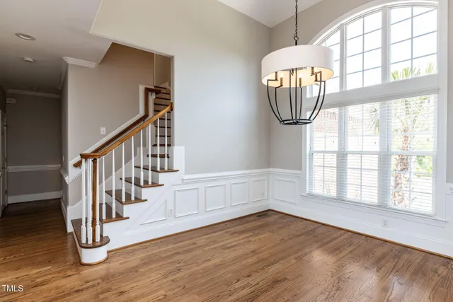 a view of an entryway with wooden floor