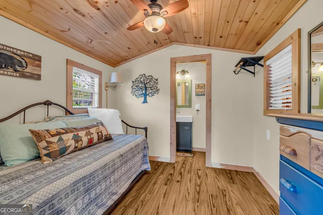 a bedroom with a large bed and a large window