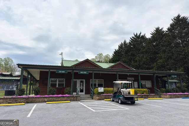 a view of a city with lush green forest