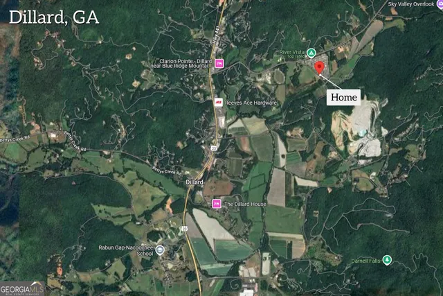 an aerial view of a swimming pool patio and mountain view in back