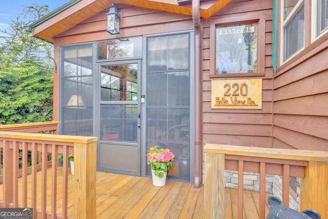 a view of a chairs with wooden fence