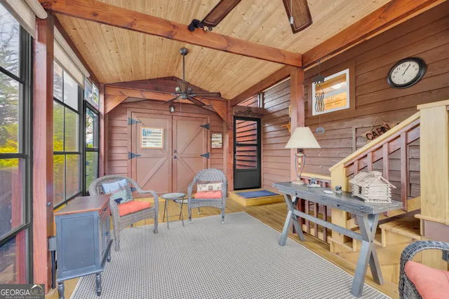 a view of a room with furniture and windows