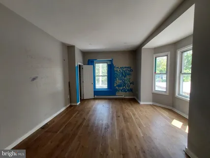 an empty room with a empty space and a window