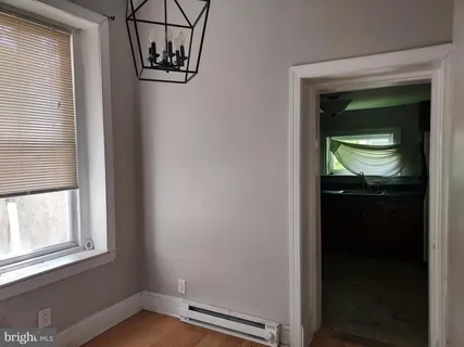 a kitchen with a refrigerator and a sink