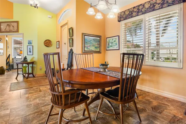 a dining room with furniture and window