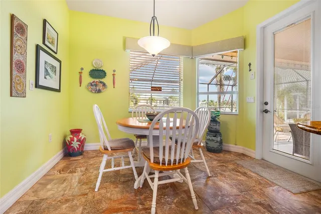 a dining room with furniture and window