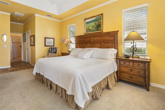 a bedroom with a bed and lamp