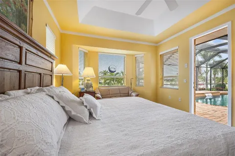 a bedroom with a large bed and a large window