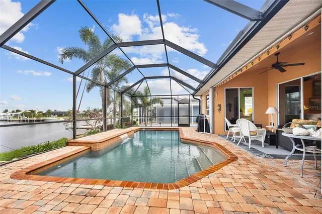 a view of a swimming pool with a lounge chairs