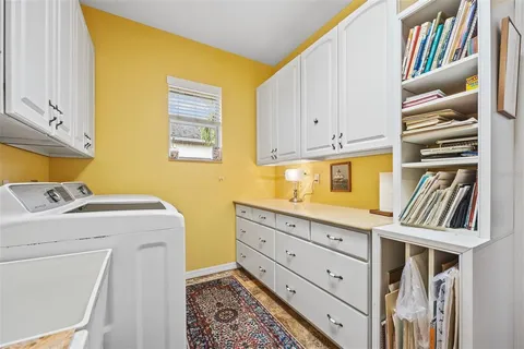 a view of a kitchen area and microwave