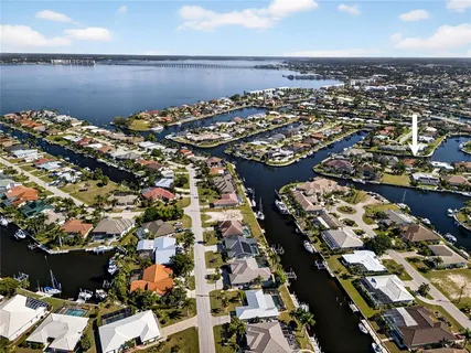 an aerial view of a house with yard lake view