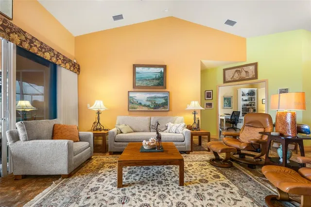 a living room with furniture and a table