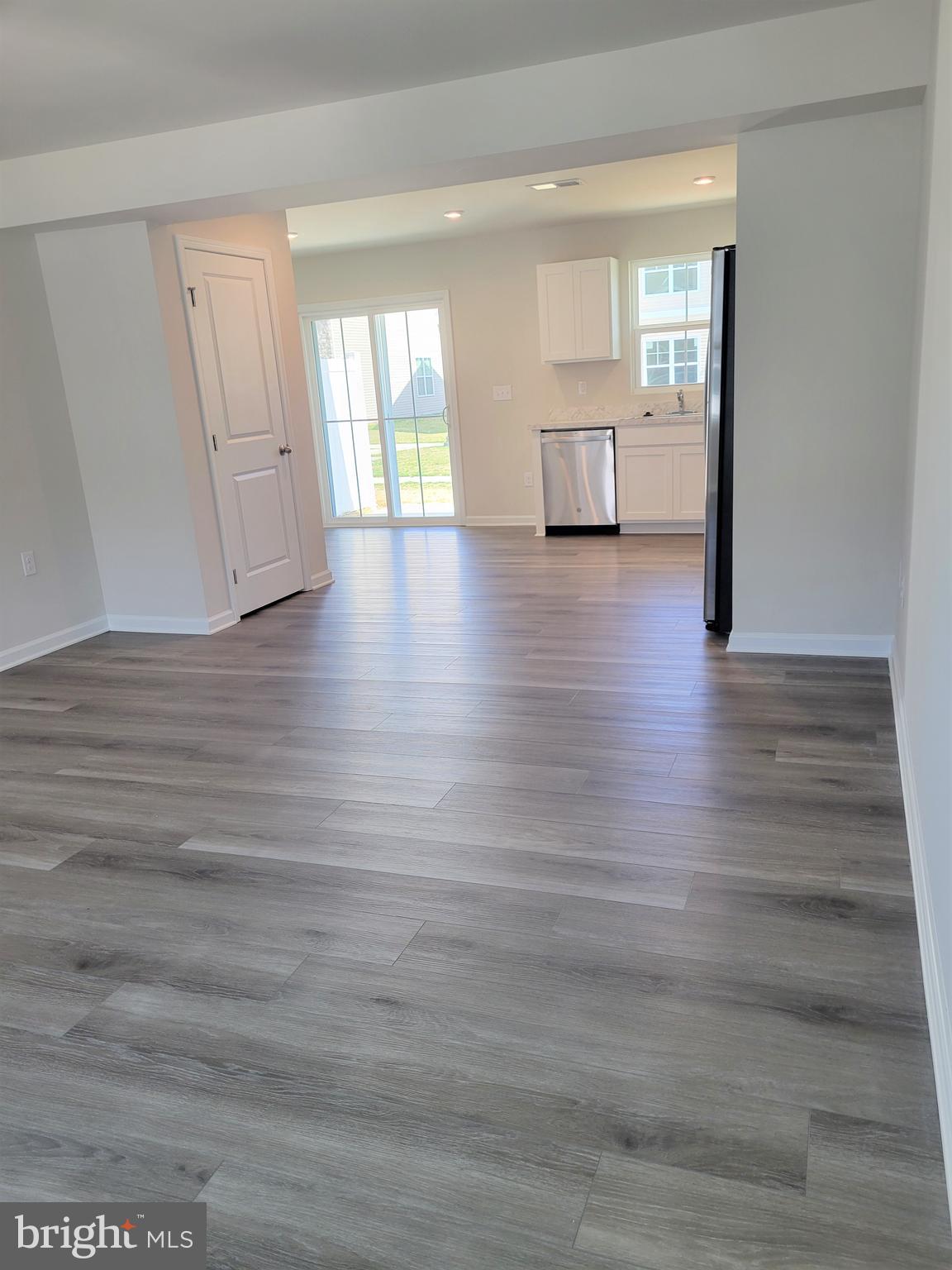28 Mulberry Lane Clementon, NJ 08021 - Photo 17 of 21 a view of empty room with wooden floor and window