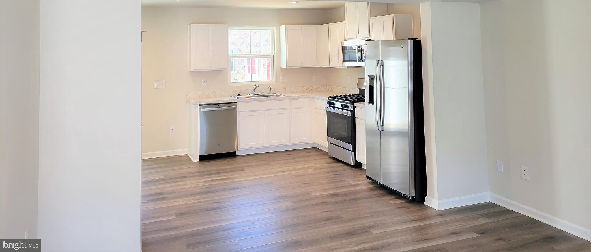 28 Mulberry Lane Clementon, NJ 08021 - Photo 2 of 21 a kitchen with white cabinets and white stainless steel appliances