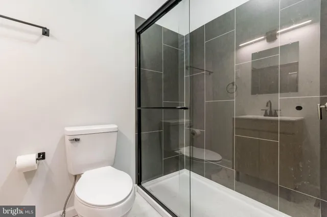 a view of a house with a yard and fence