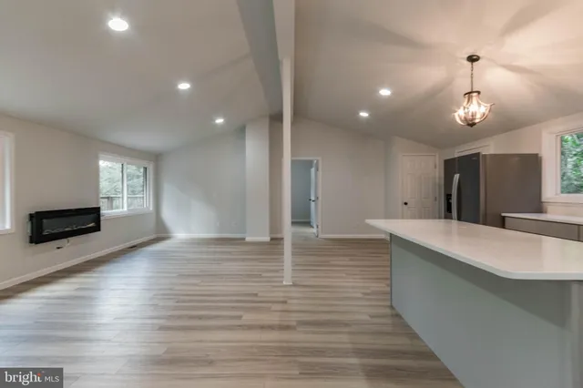 a view of backyard with a deck and wooden floor