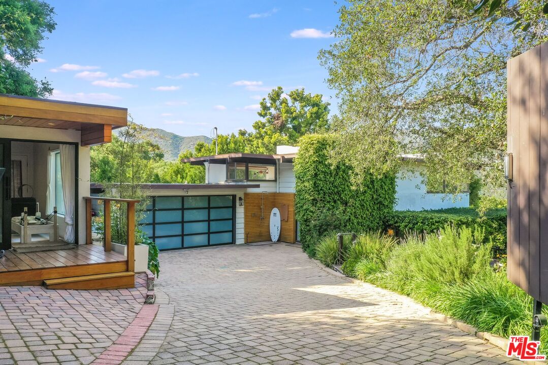 a house view with a garden space