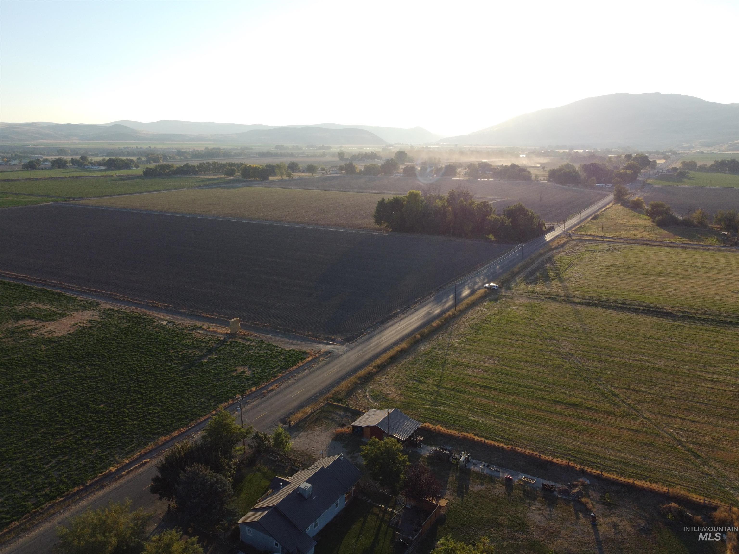 1854 Guilford Road Weiser, ID 83672 - Photo 17 of 33 Aerial overview of property's location featuring rural landscape and a mountainous background