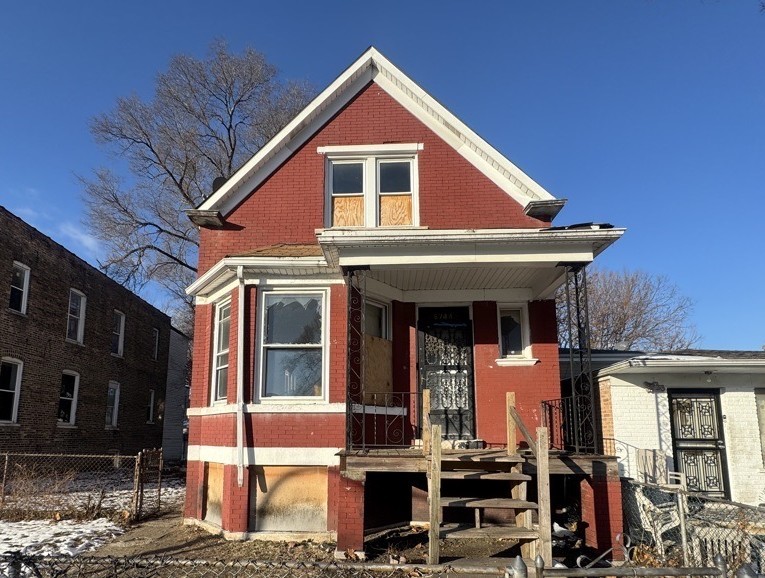 a front view of a house with glass windows