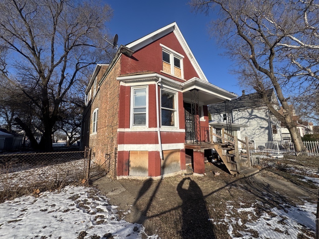 6744 South Bishop Street Chicago, IL 60636 - Photo 2 of 13 a front view of a house with a yard