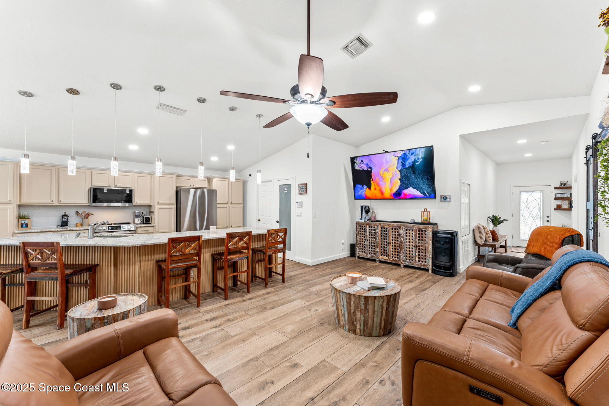 1292 Brumpton Place Rockledge, FL 32955 - Photo 13 of 69 a living room with lots of furniture and kitchen view
