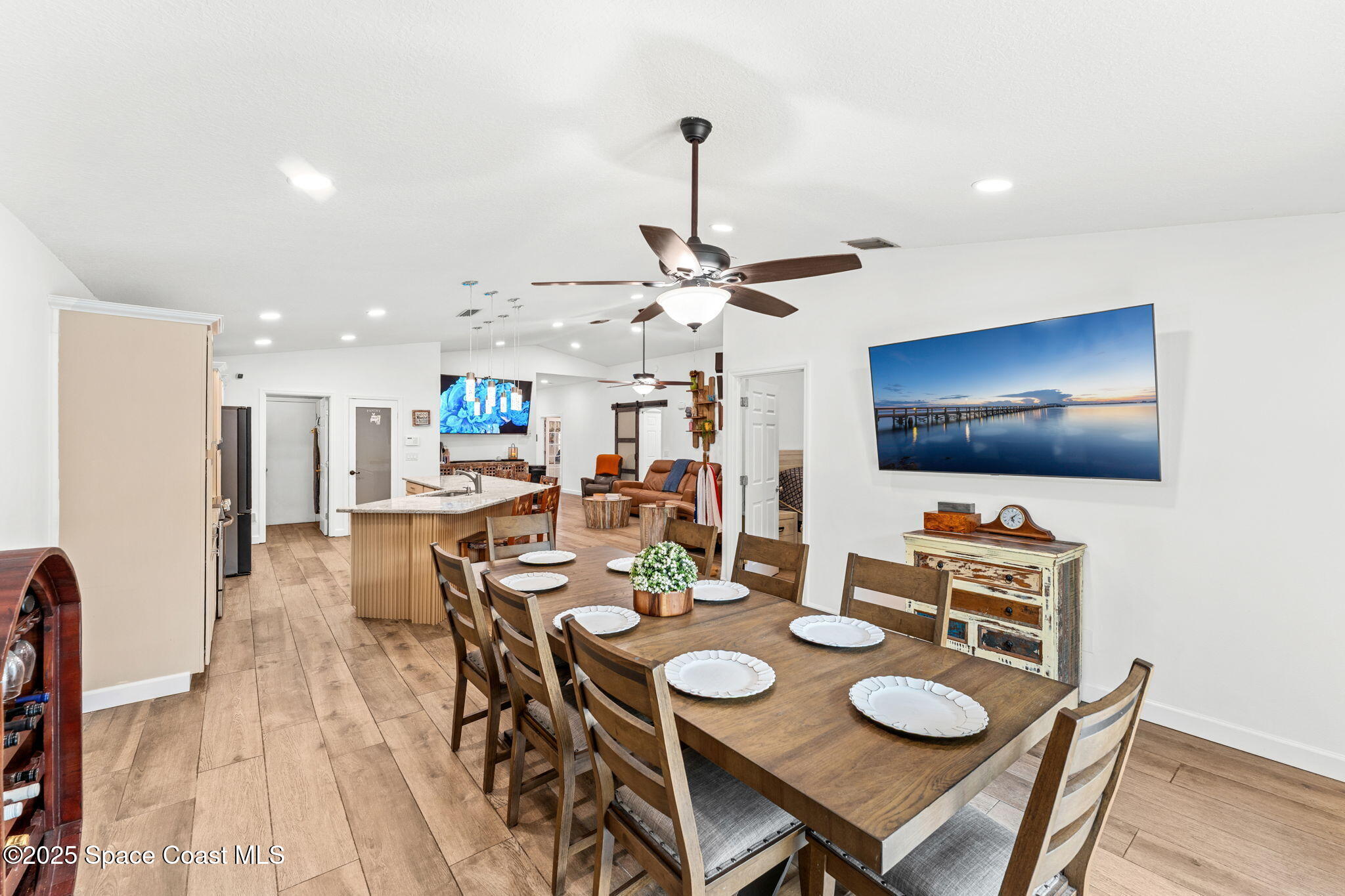1292 Brumpton Place Rockledge, FL 32955 - Photo 15 of 69 a view of a dining room with furniture and wooden floor