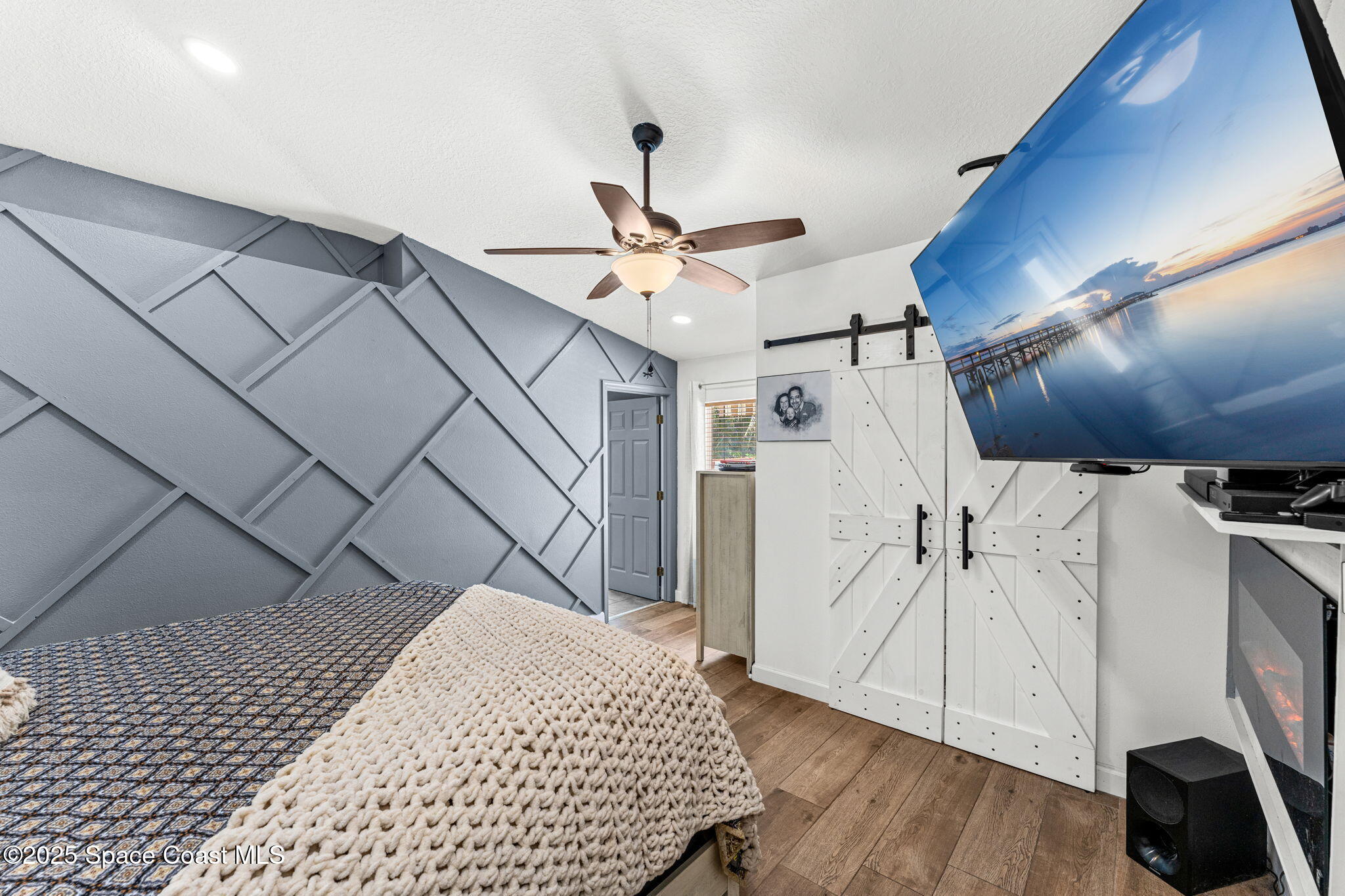 1292 Brumpton Place Rockledge, FL 32955 - Photo 21 of 69 a bedroom with a bed and a ceiling fan