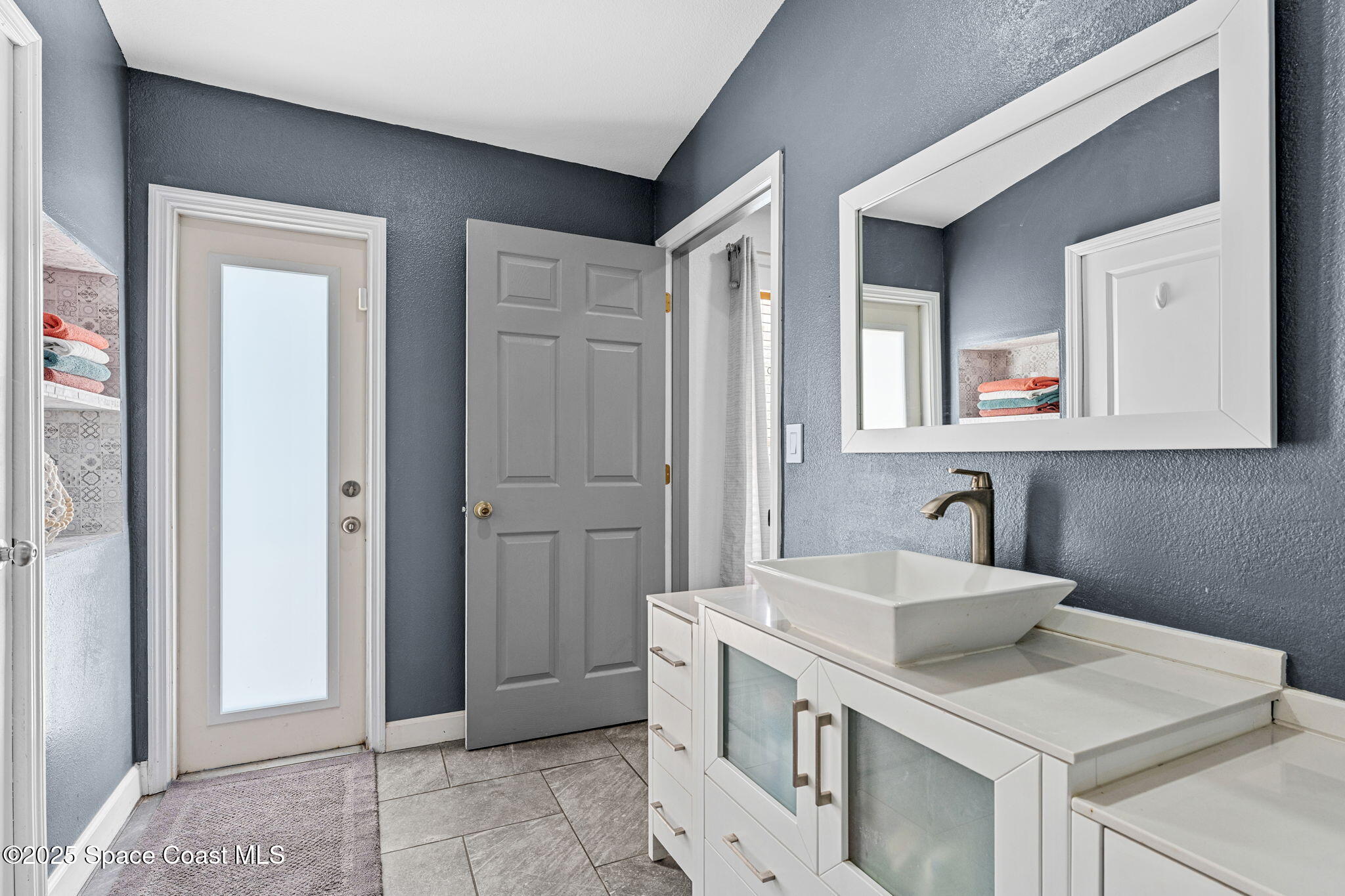 1292 Brumpton Place Rockledge, FL 32955 - Photo 25 of 69 a bathroom with a sink and a mirror