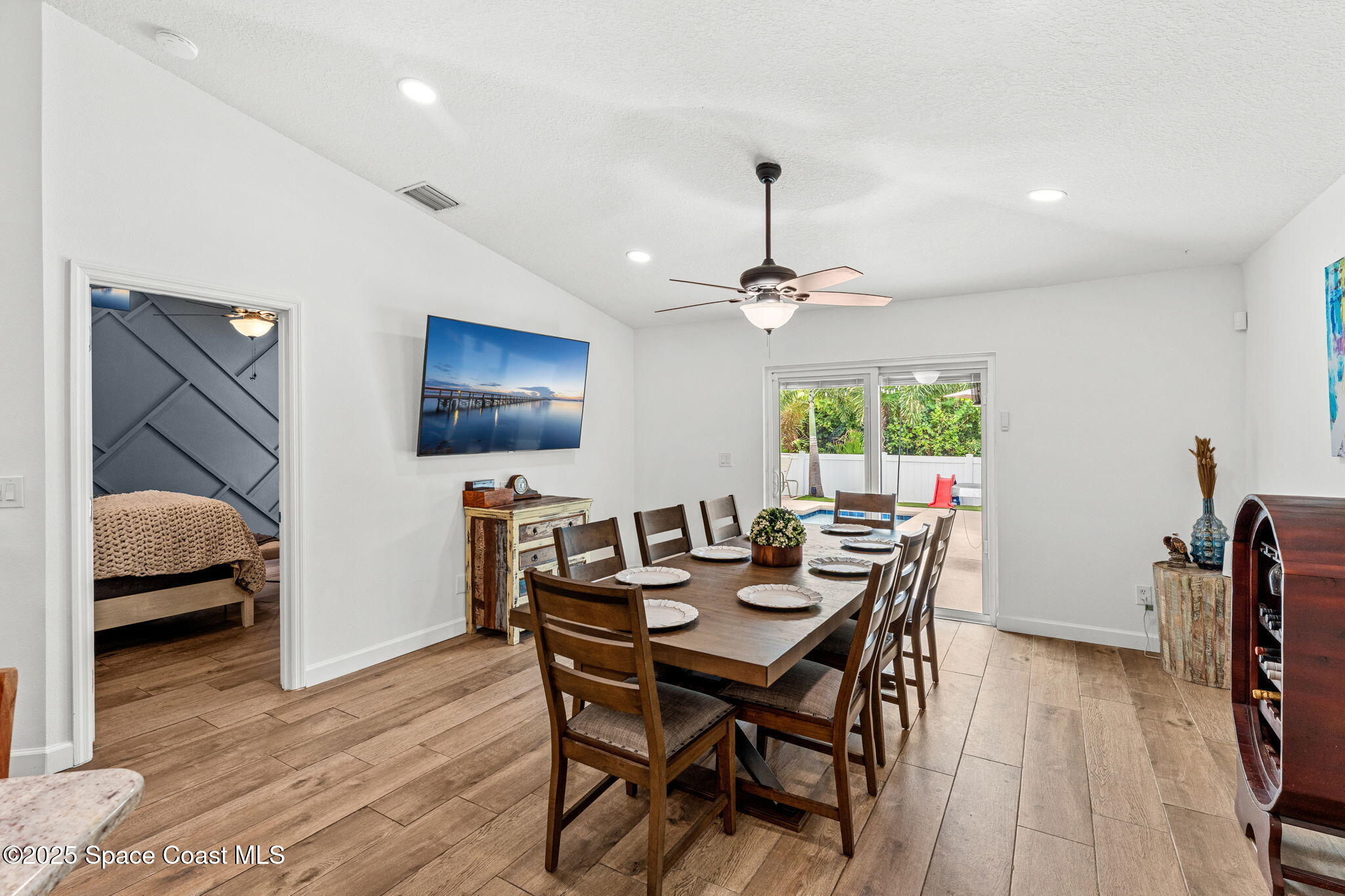 1292 Brumpton Place Rockledge, FL 32955 - Photo 26 of 69 a view of a dining room with furniture and wooden floor