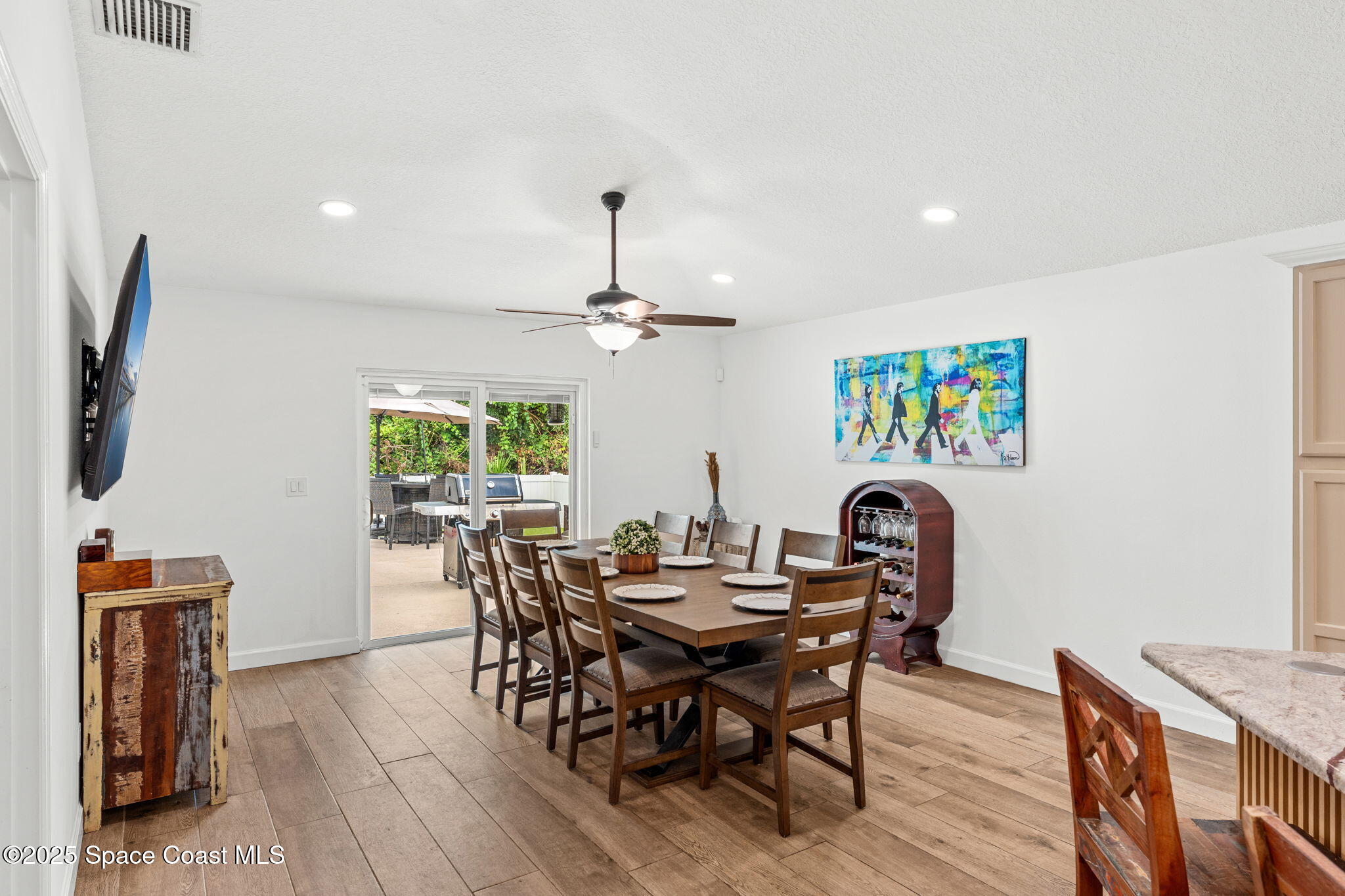 1292 Brumpton Place Rockledge, FL 32955 - Photo 27 of 69 a view of a dining room with furniture window and wooden floor