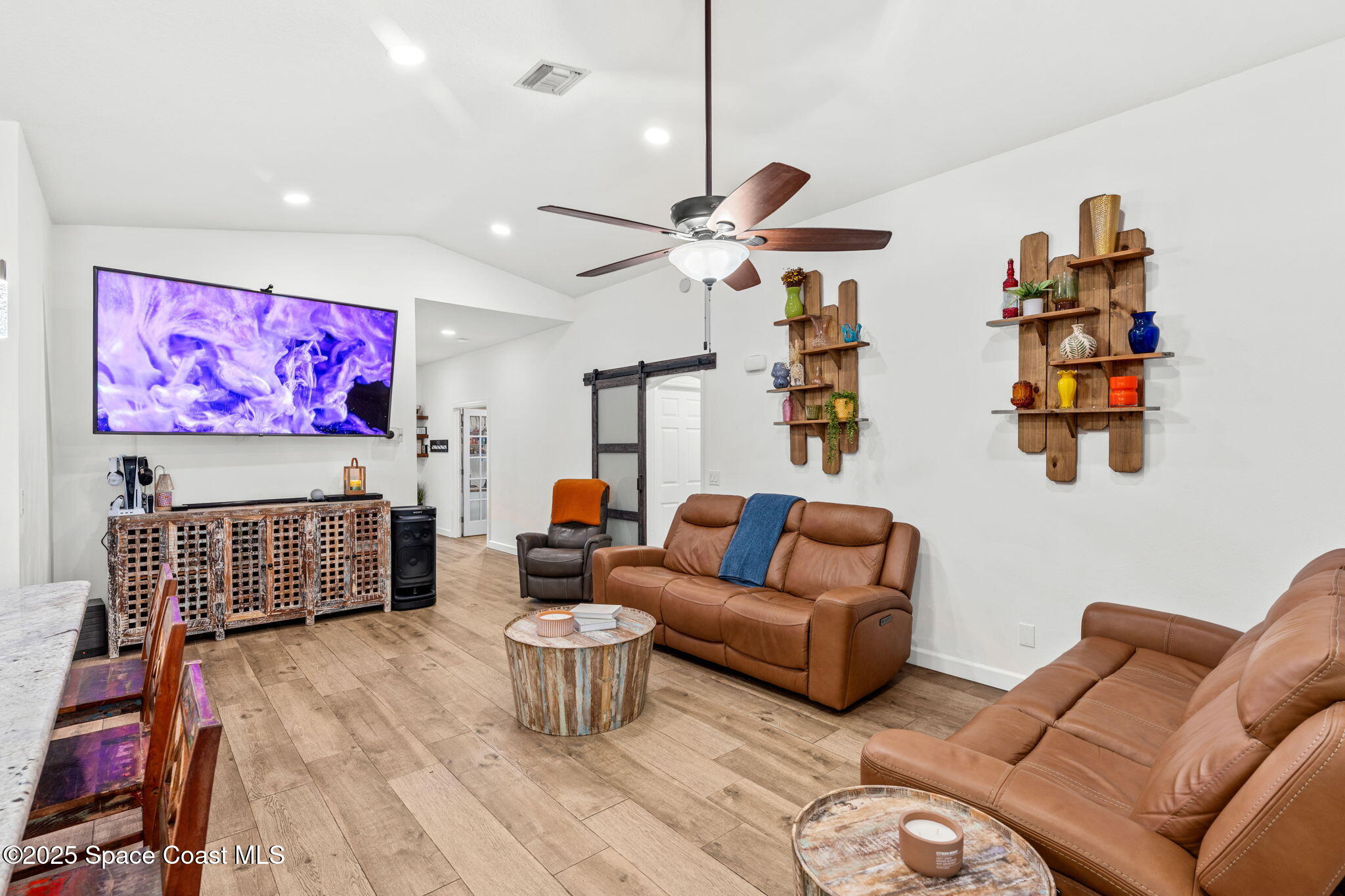 1292 Brumpton Place Rockledge, FL 32955 - Photo 28 of 69 a living room with furniture a rug and a chandelier