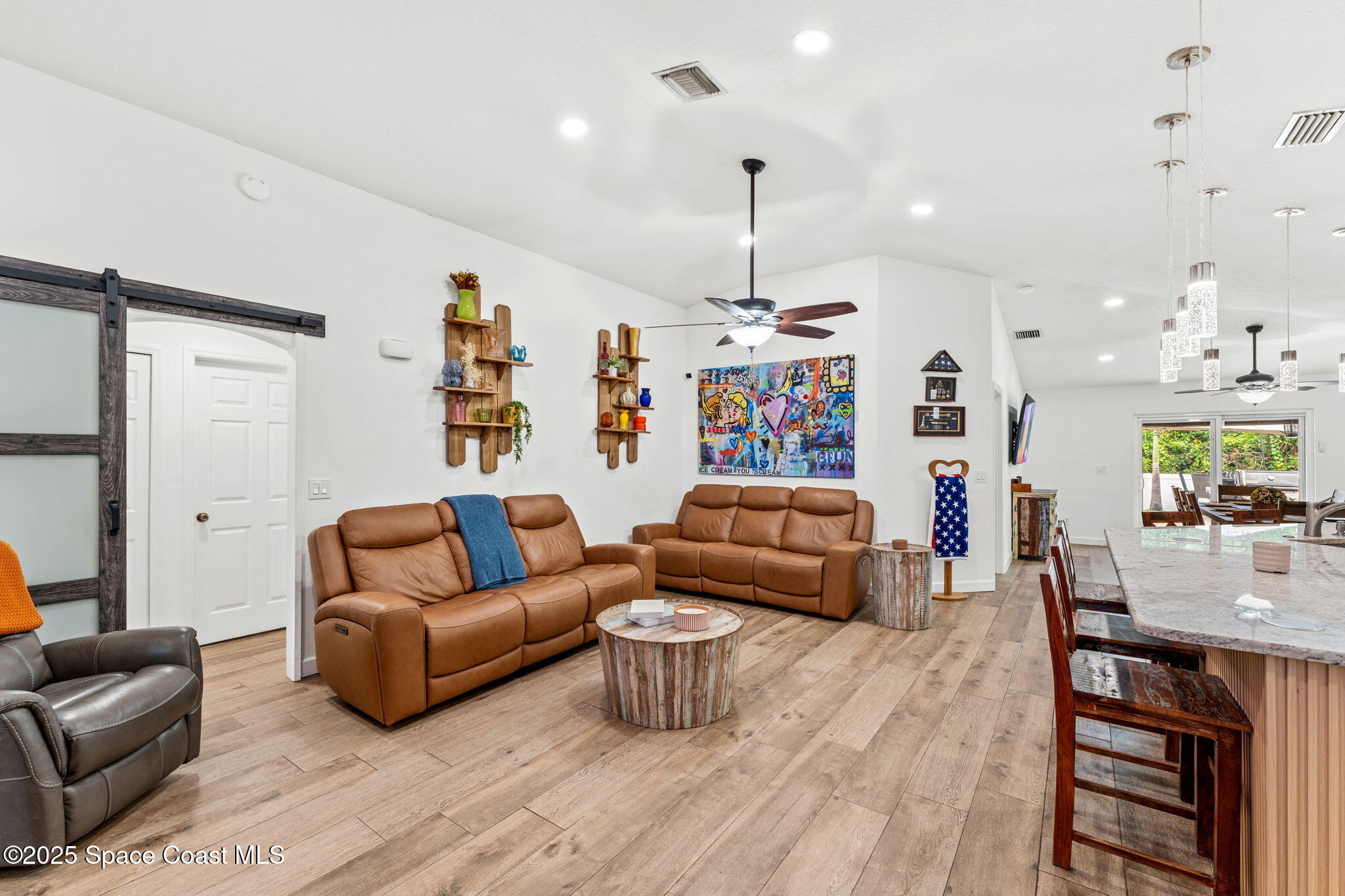 1292 Brumpton Place Rockledge, FL 32955 - Photo 29 of 69 a living room with furniture and wooden floor