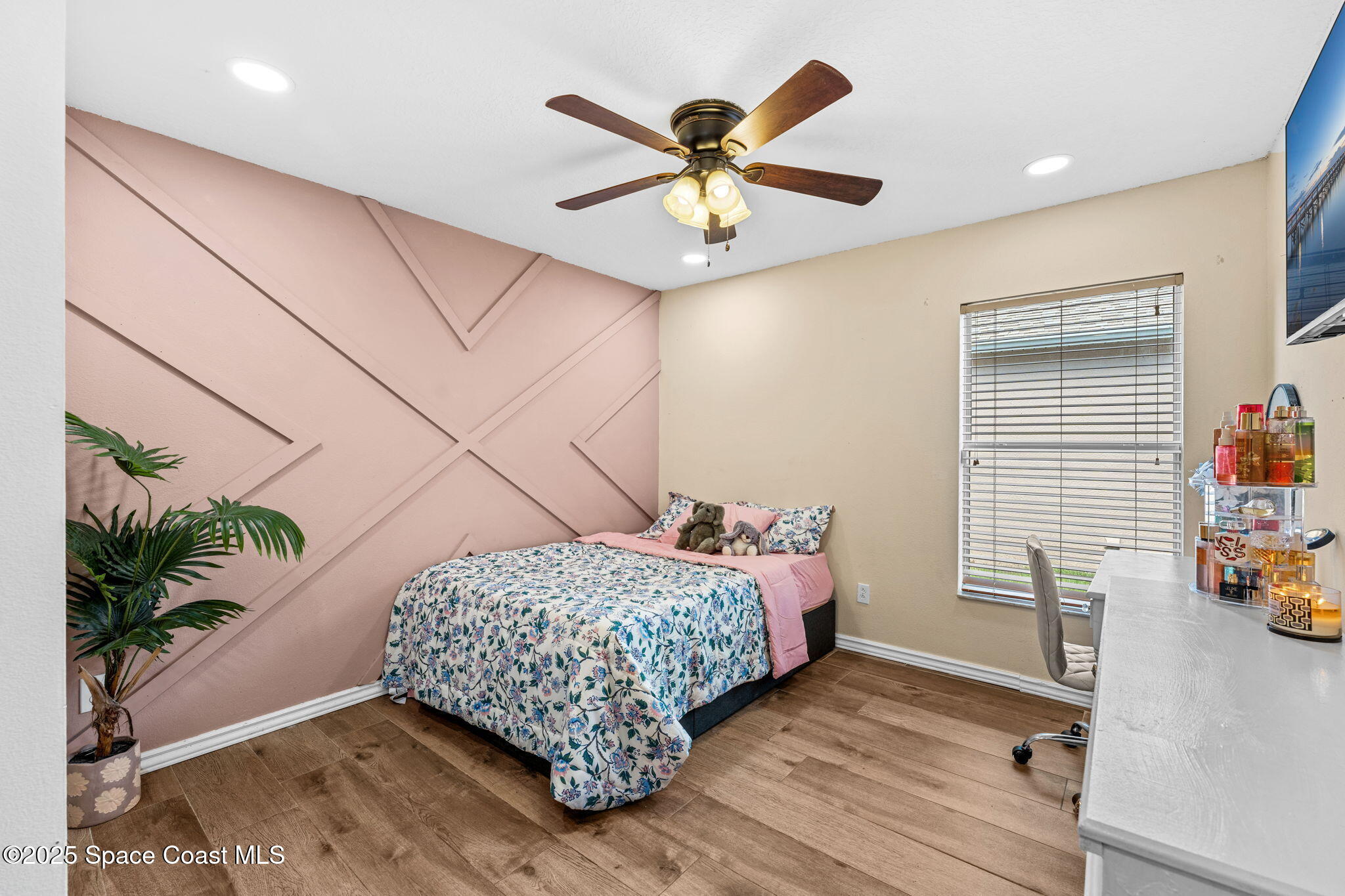 1292 Brumpton Place Rockledge, FL 32955 - Photo 31 of 69 a bedroom with a bed and a chandelier