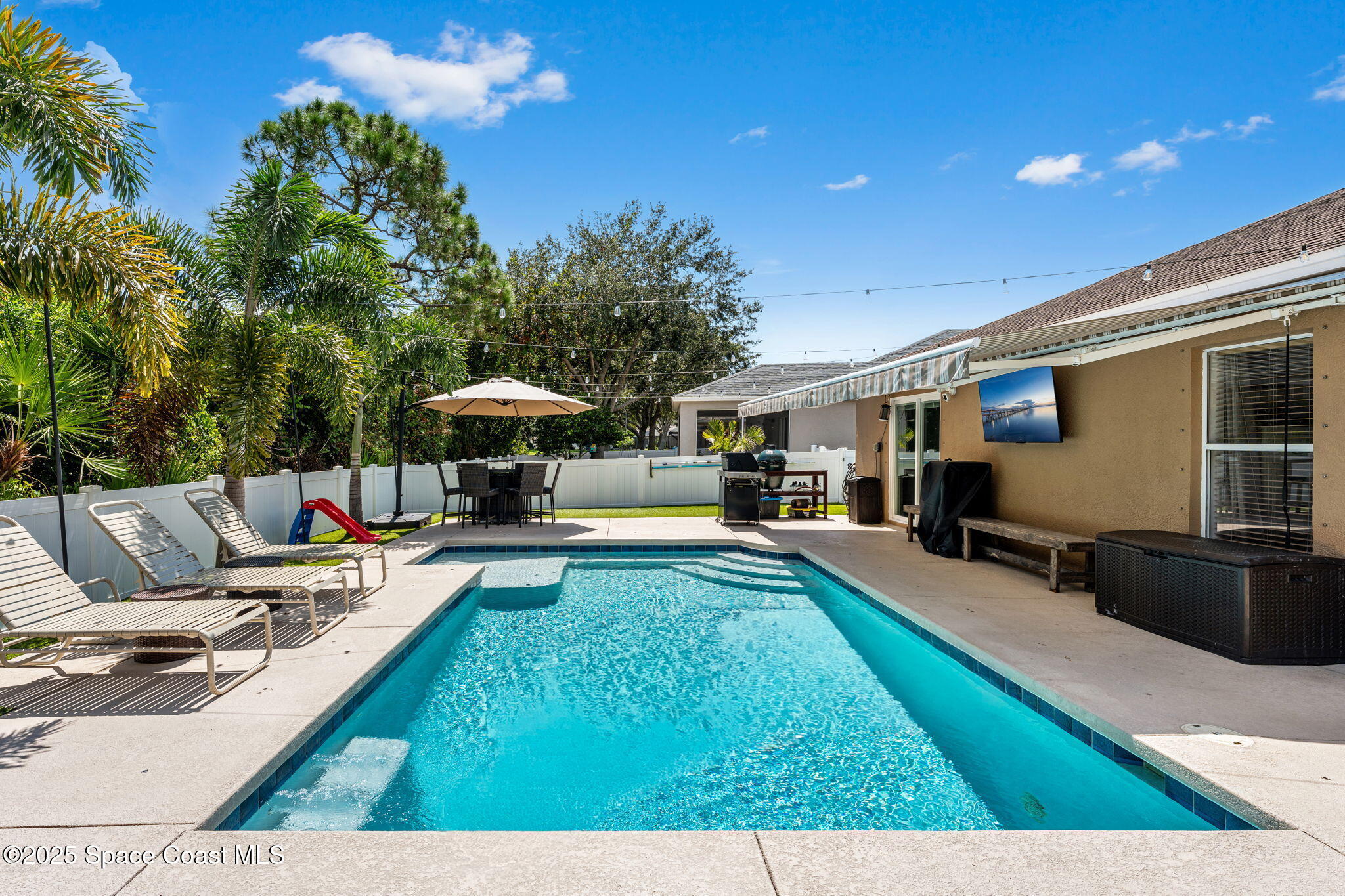 1292 Brumpton Place Rockledge, FL 32955 - Photo 35 of 69 a view of a house with swimming pool and sitting area