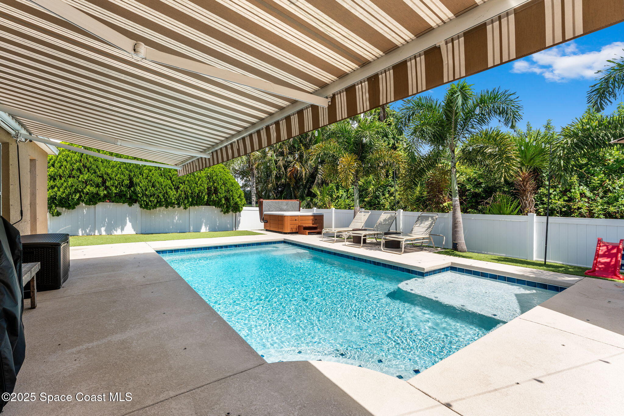 1292 Brumpton Place Rockledge, FL 32955 - Photo 37 of 69 a view of a swimming pool with a patio