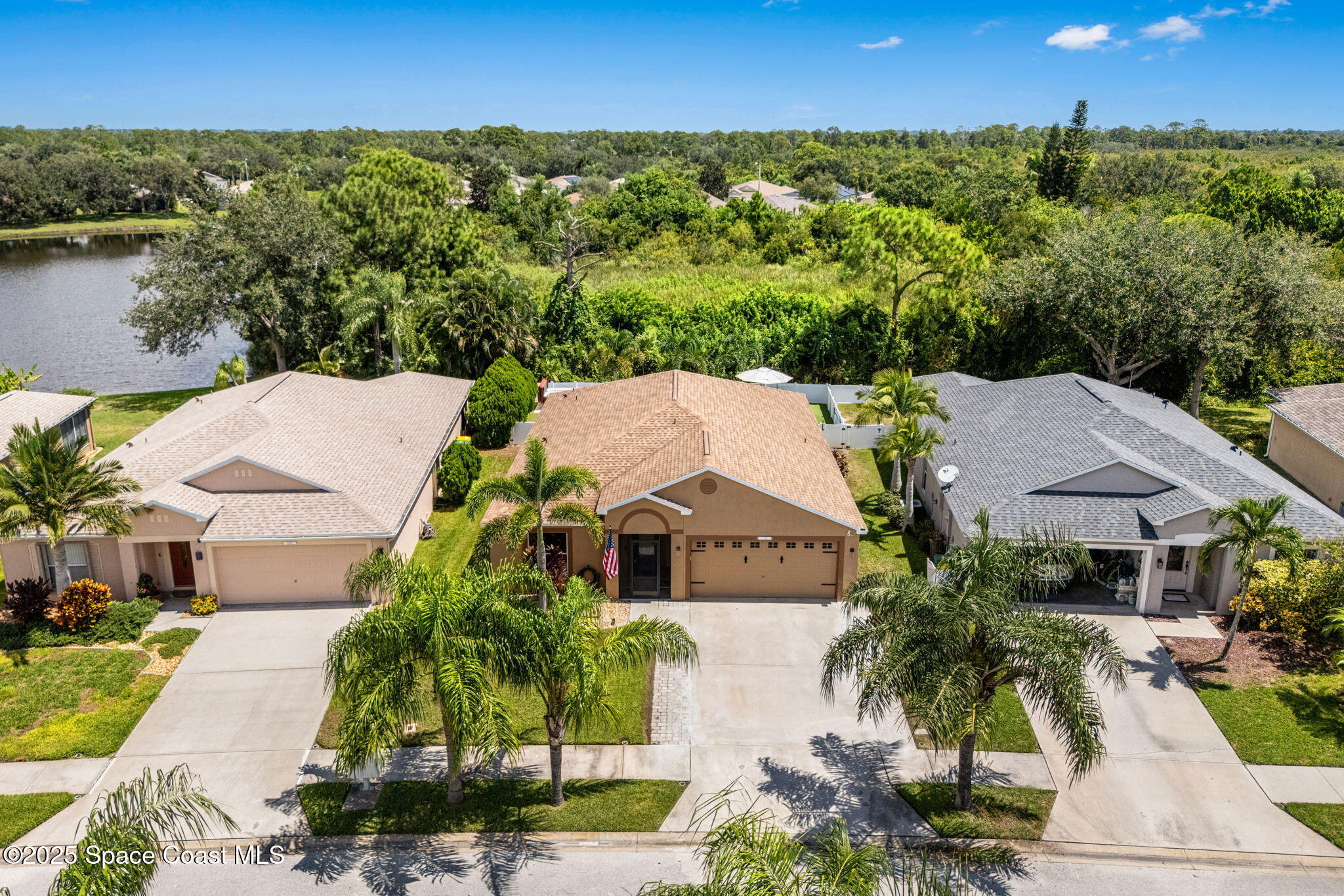 1292 Brumpton Place Rockledge, FL 32955 - Photo 41 of 69 a aerial view of a house with a yard and lake view