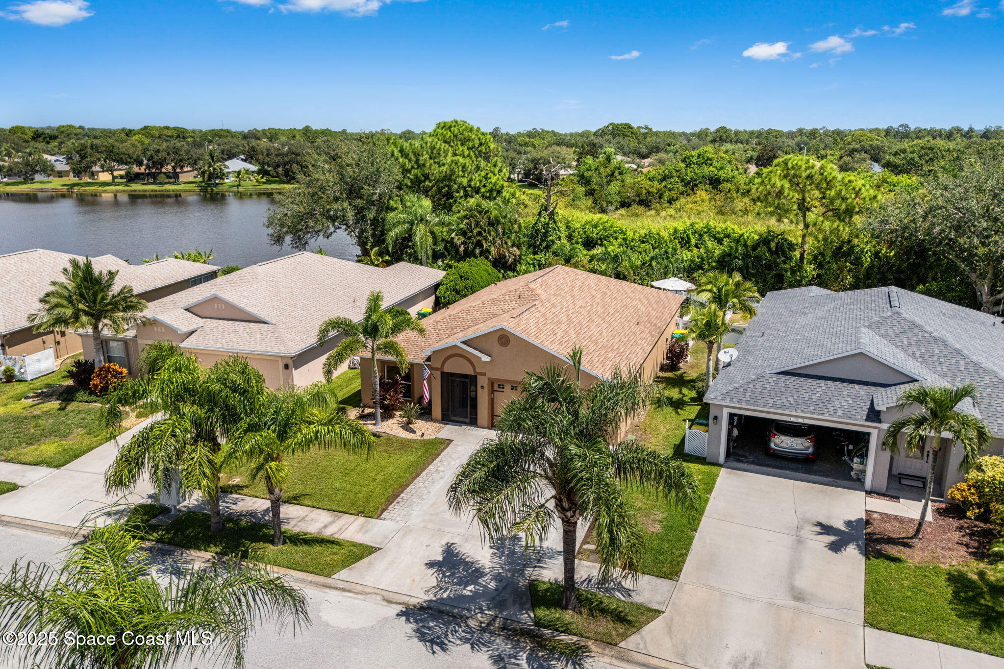 1292 Brumpton Place Rockledge, FL 32955 - Photo 43 of 69 an aerial view of a house with a lake view