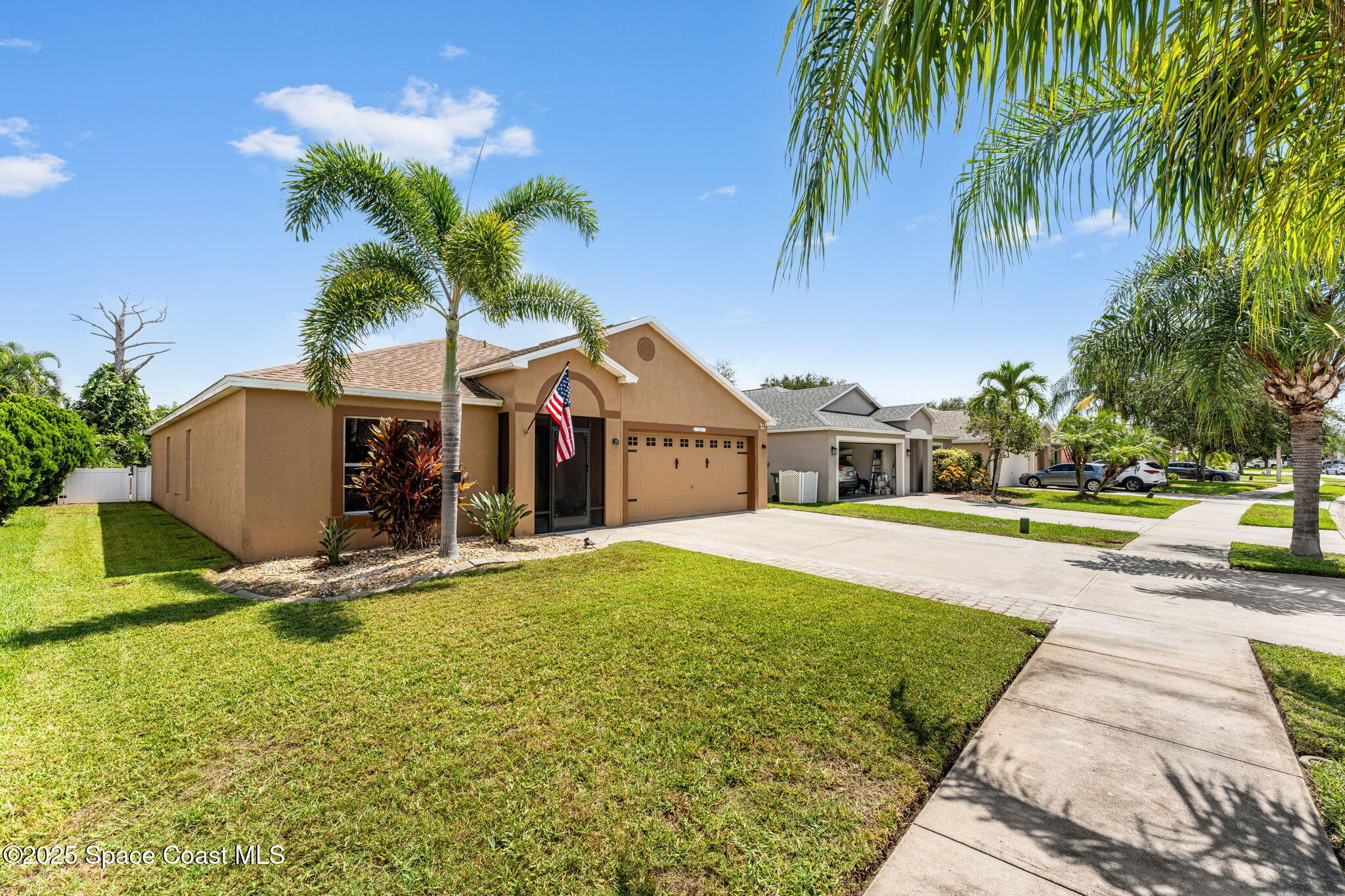 1292 Brumpton Place Rockledge, FL 32955 - Photo 44 of 69 a front view of a house with garden