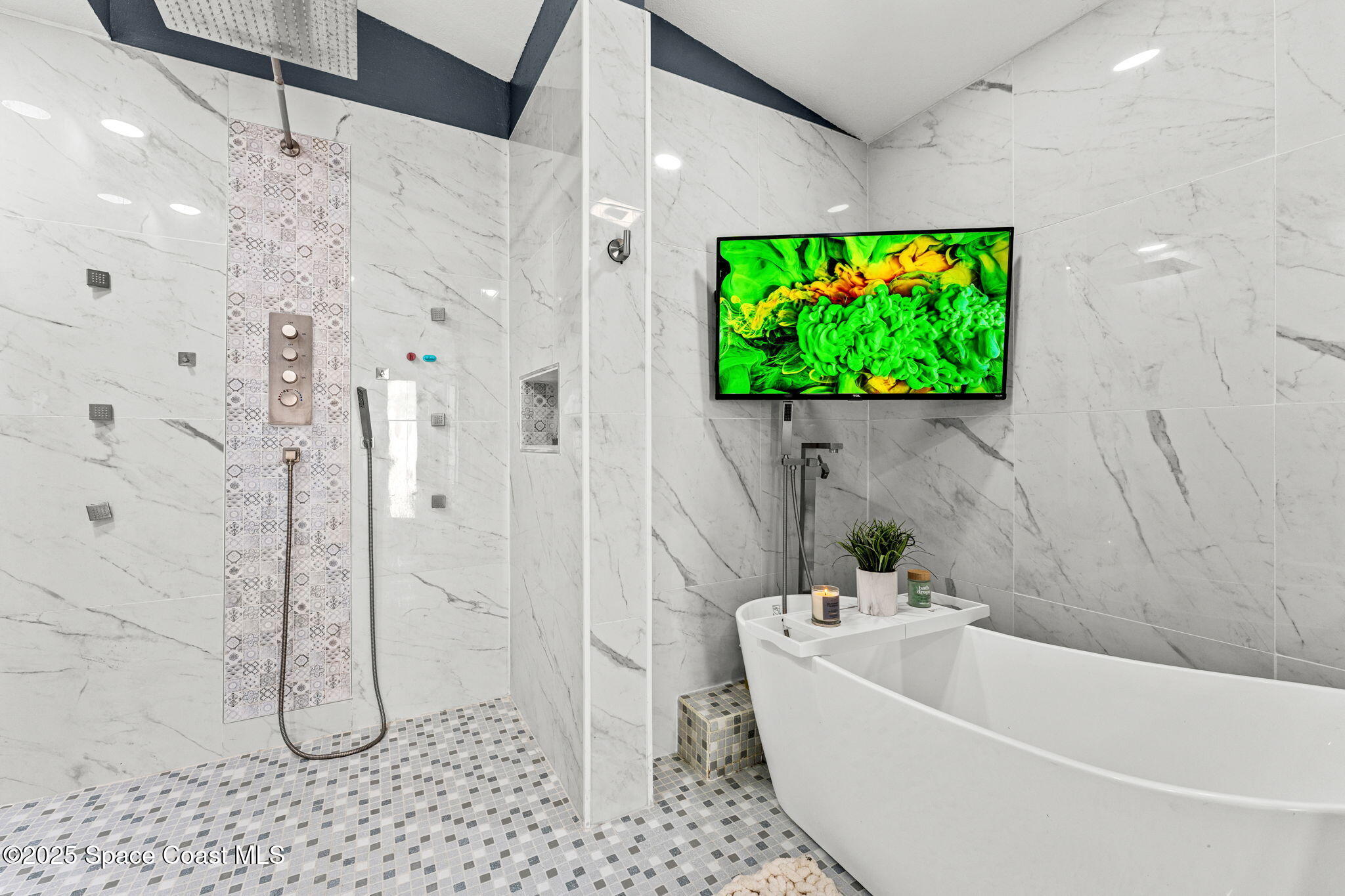 1292 Brumpton Place Rockledge, FL 32955 - Photo 5 of 69 a bathroom with a tub and a shower