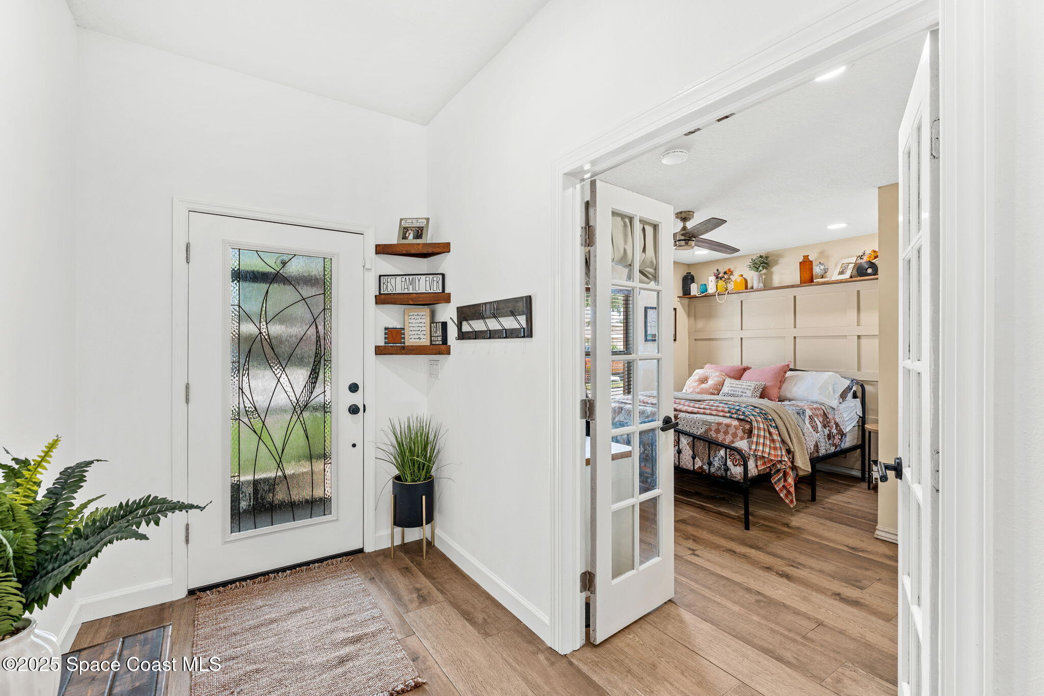 1292 Brumpton Place Rockledge, FL 32955 - Photo 6 of 69 a bedroom with furniture and wooden floor