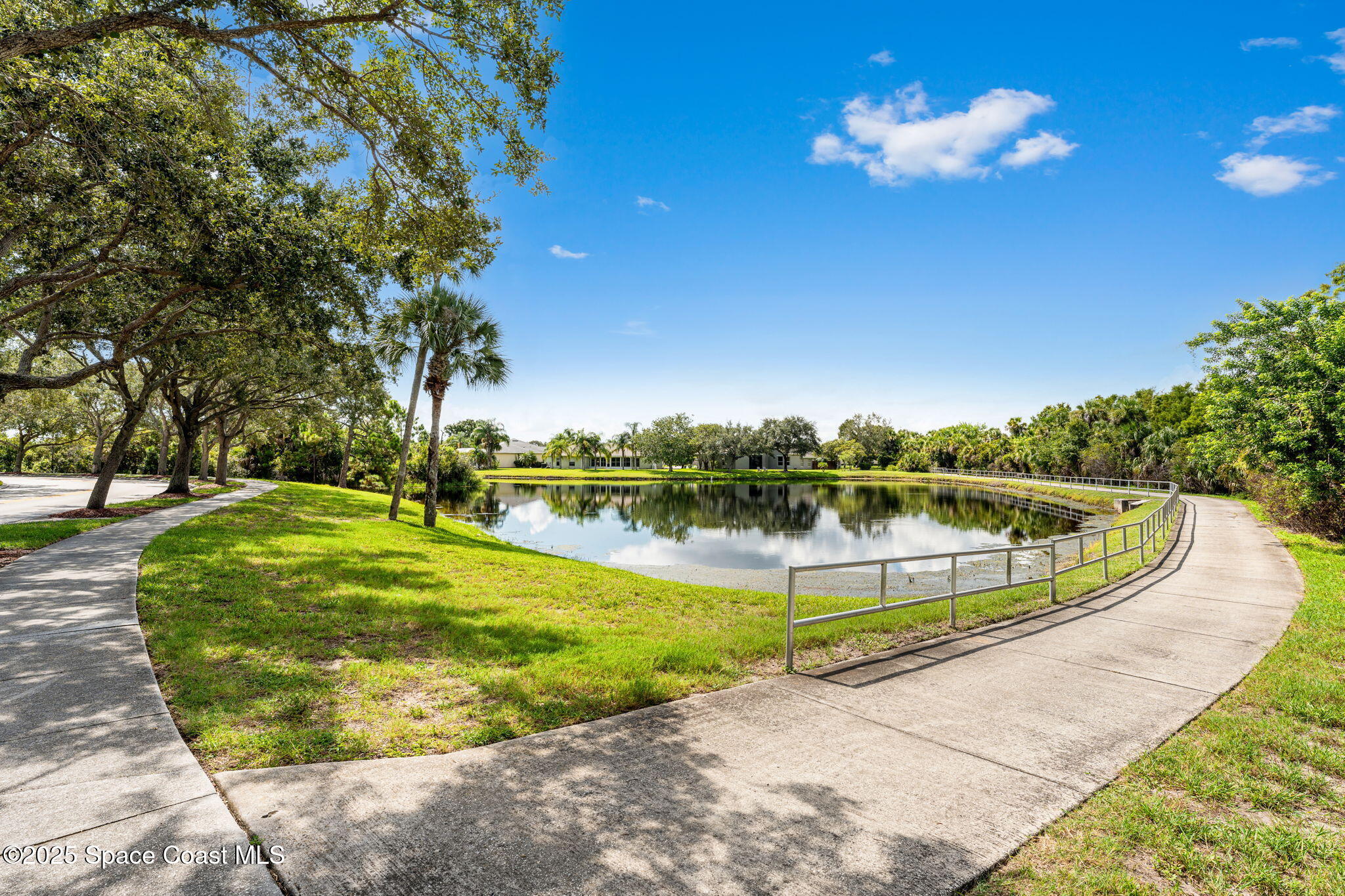 1292 Brumpton Place Rockledge, FL 32955 - Photo 63 of 69 a view of a swimming pool with a fountain