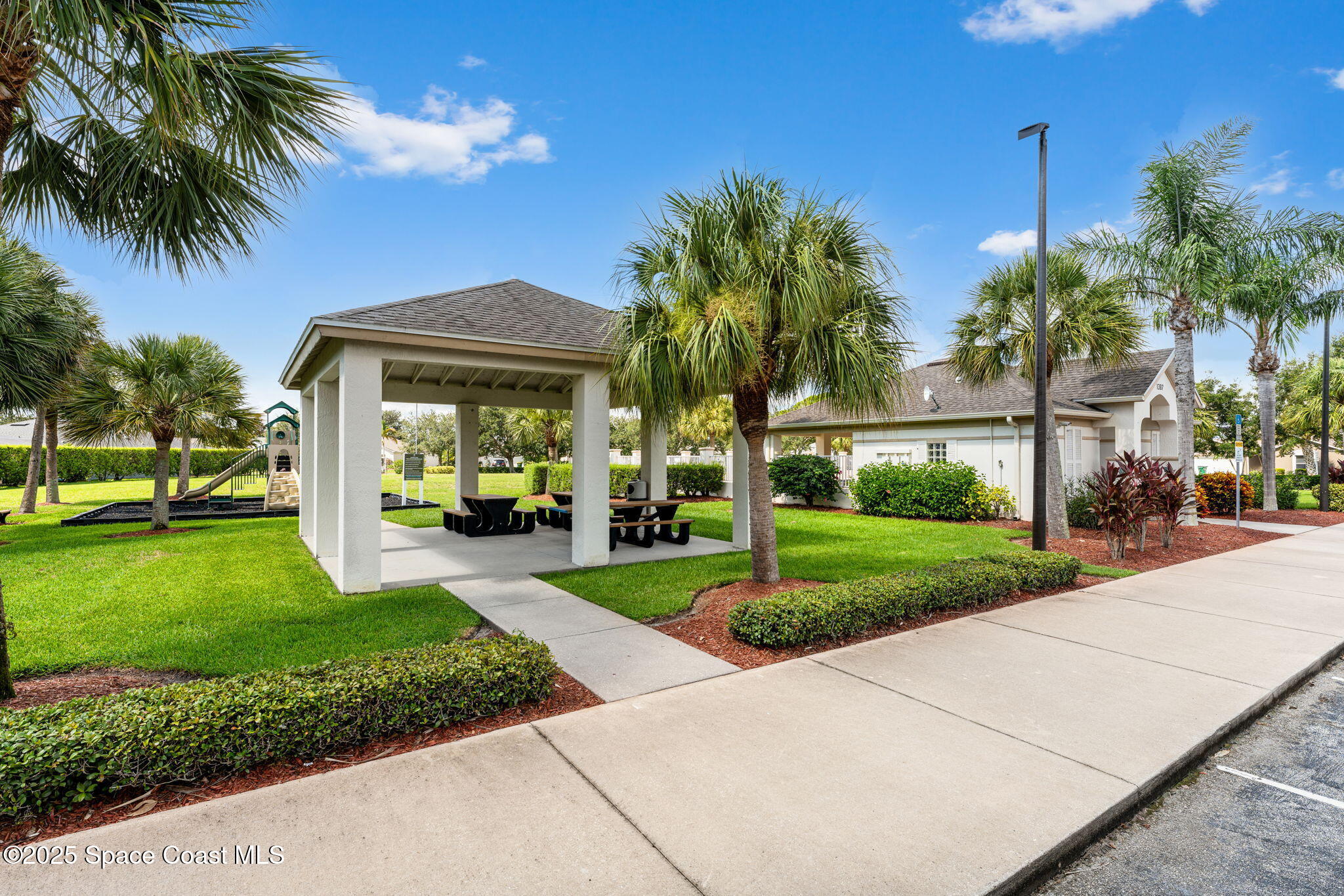 1292 Brumpton Place Rockledge, FL 32955 - Photo 68 of 69 a front view of a house with garden