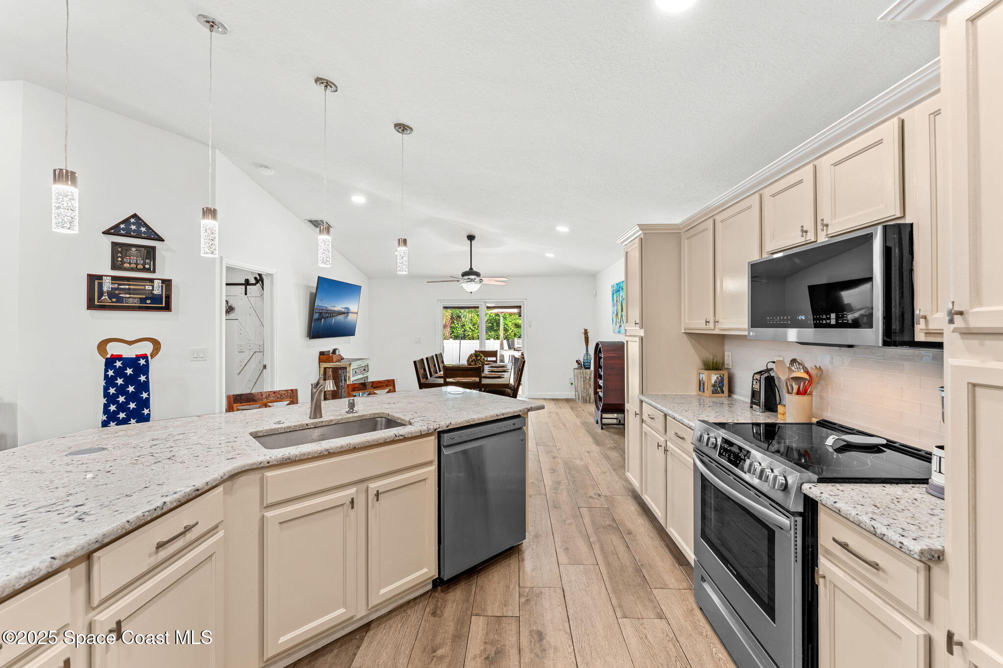 1292 Brumpton Place Rockledge, FL 32955 - Photo 10 of 69 a kitchen with stainless steel appliances granite countertop a sink and stove top oven