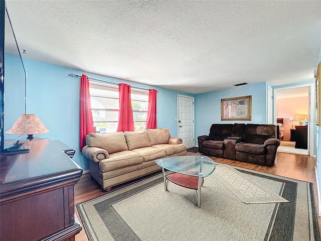 a living room with furniture and a window