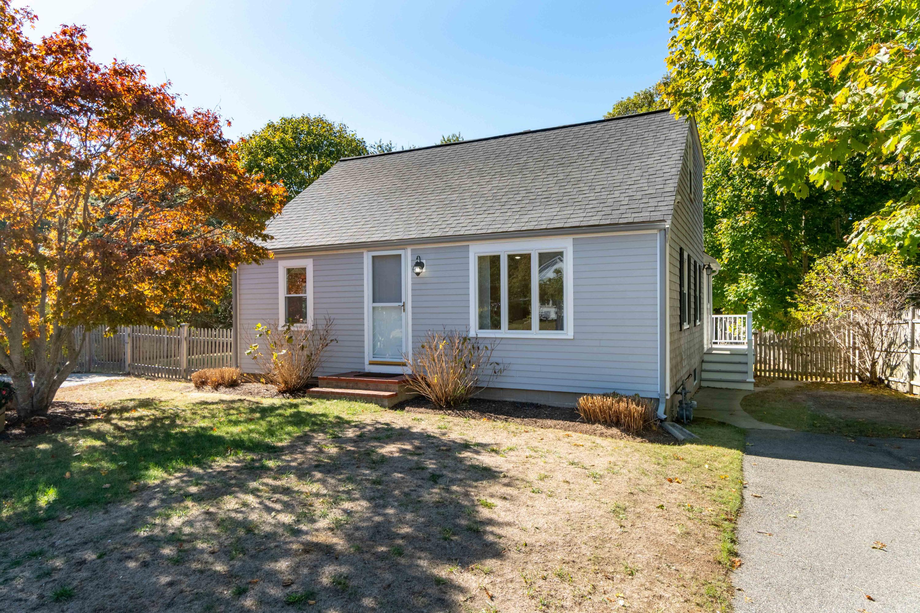 85 Old Town Road Hyannis, MA 02601 - Photo 1 of 26 a backyard of a house with yard and outdoor seating