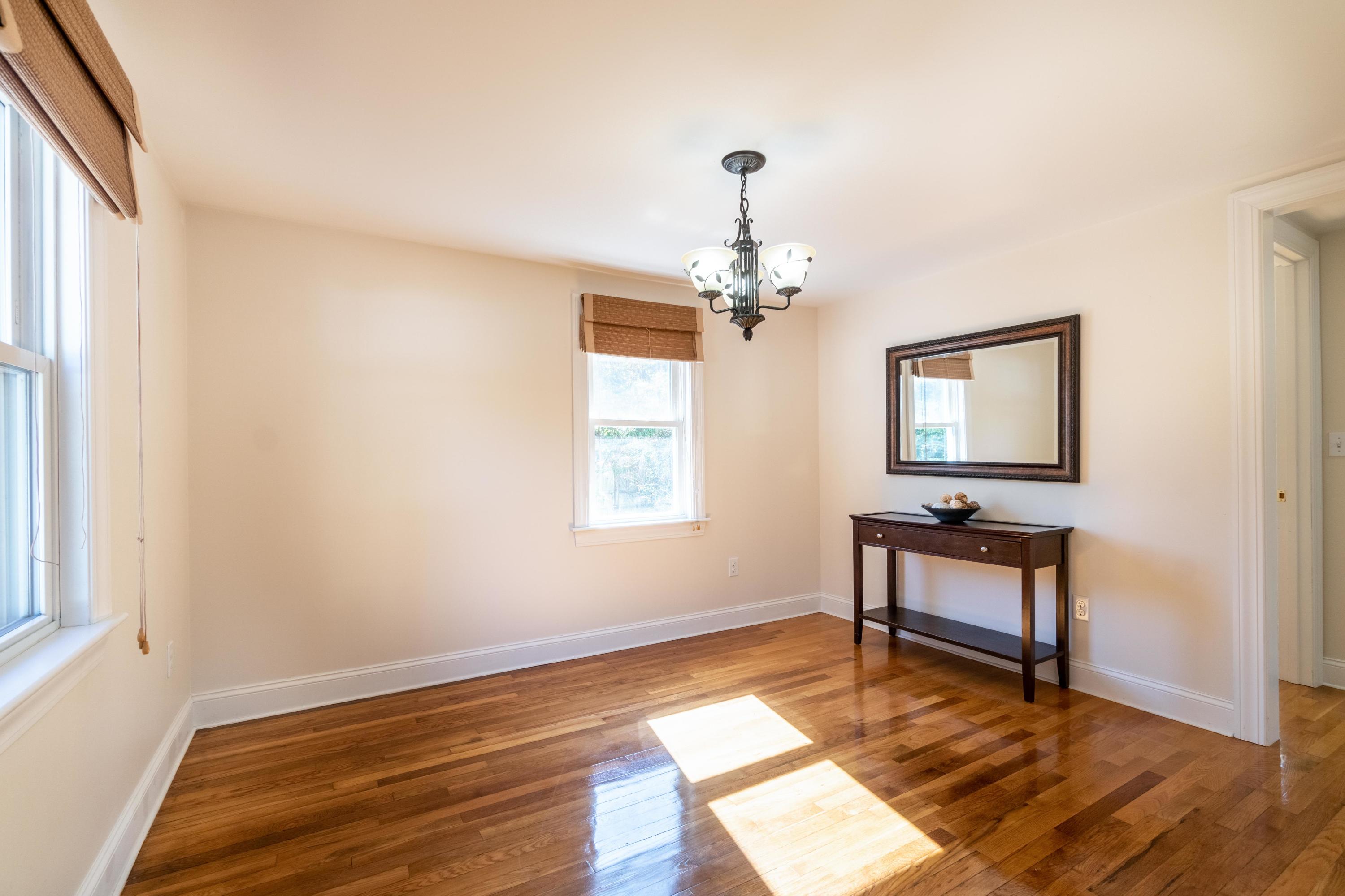85 Old Town Road Hyannis, MA 02601 - Photo 11 of 26 a room with wooden floor a piano and windows