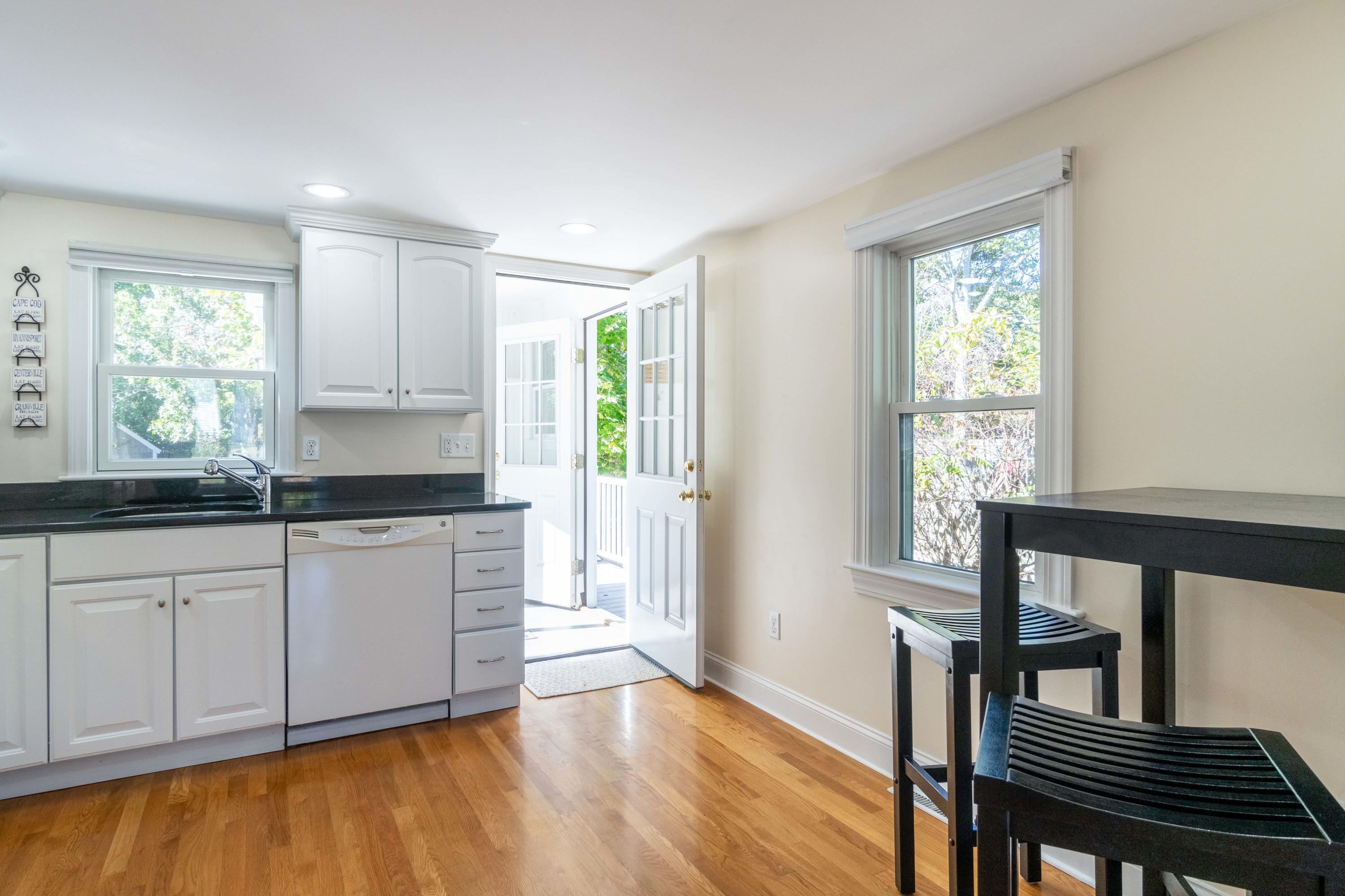 85 Old Town Road Hyannis, MA 02601 - Photo 5 of 26 a kitchen with granite countertop a stove a sink and a window