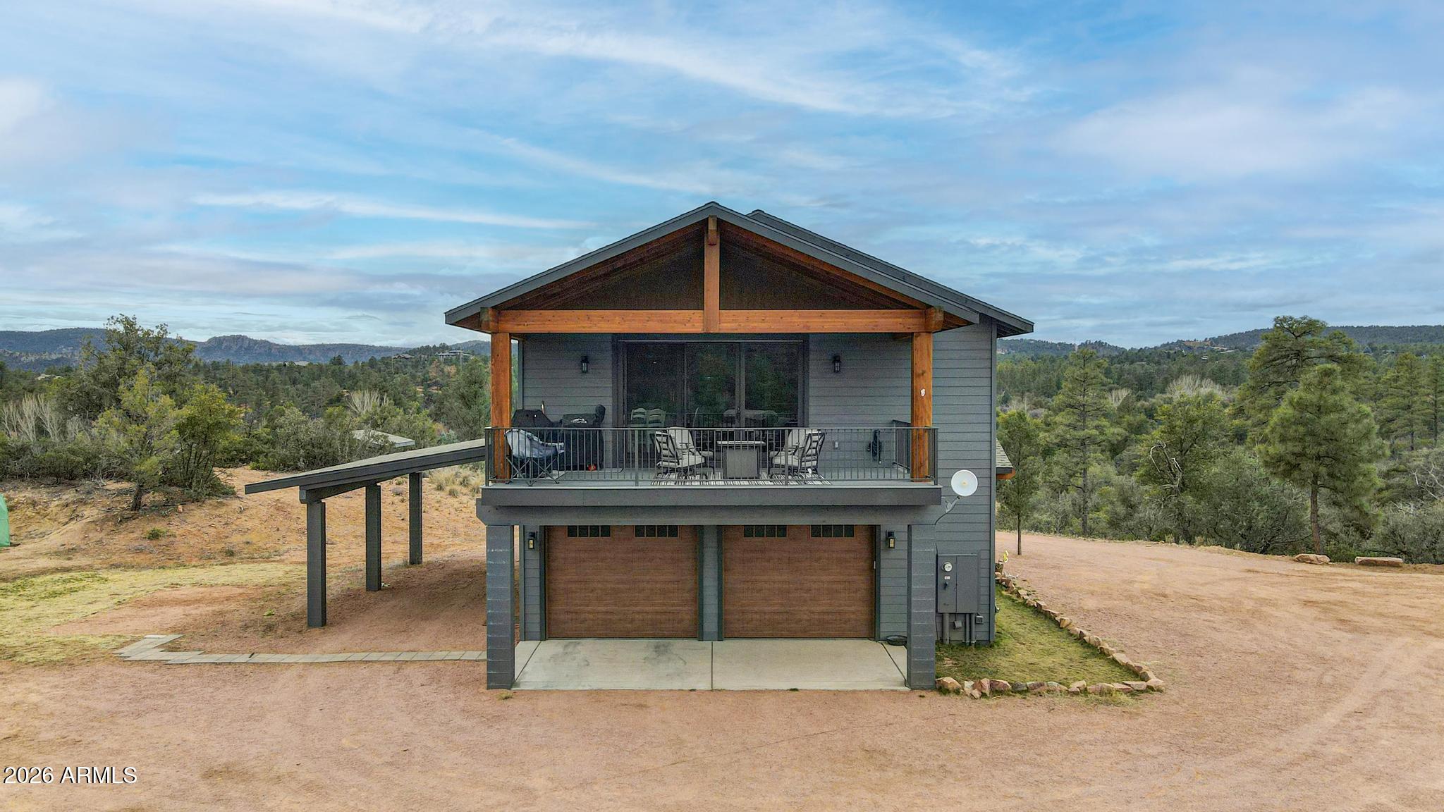 210 Valley Road Payson, AZ 85541 - Photo 1 of 38 a view of a terrace with a garden and trees